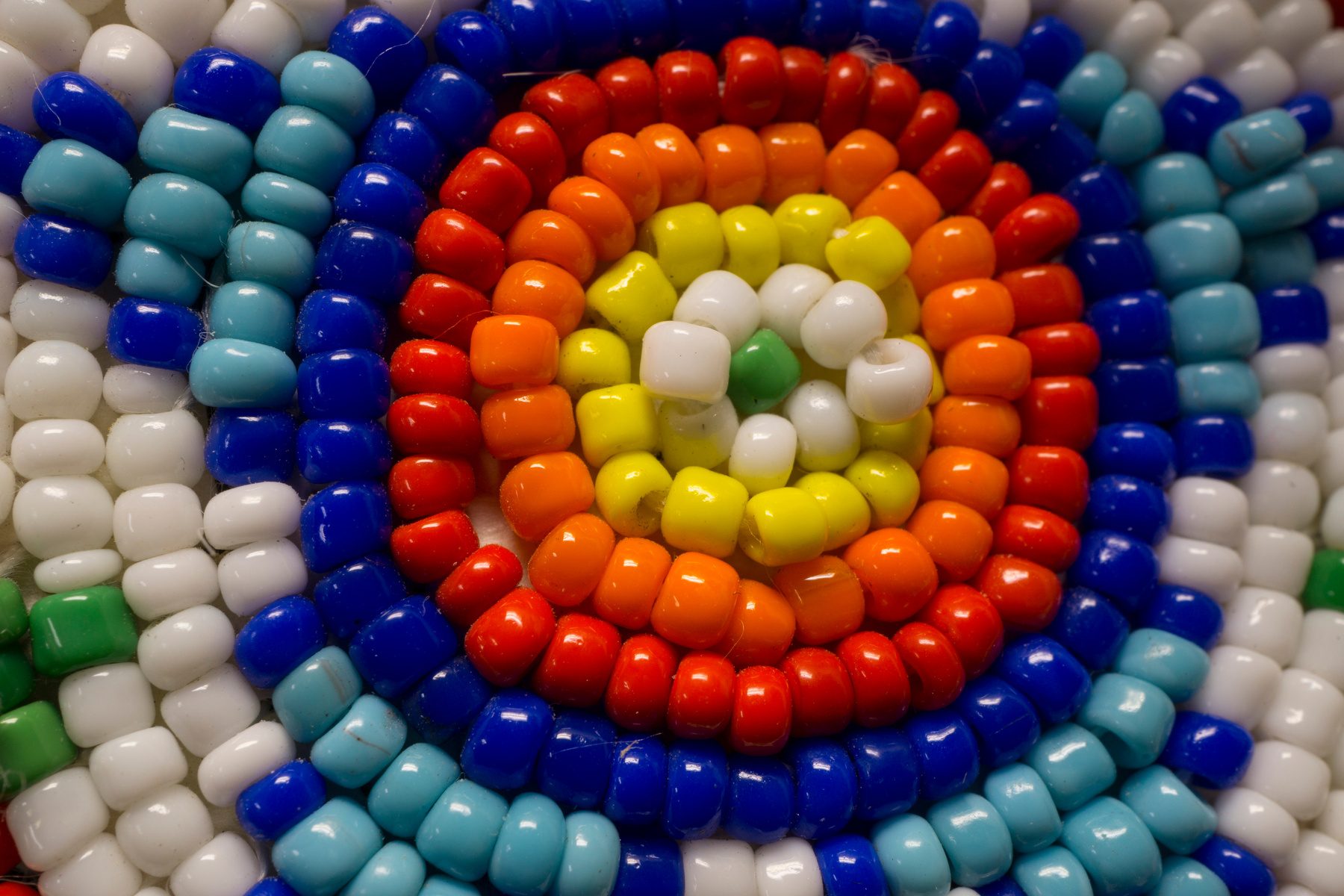 Colourful Indigenous beadwork medallion